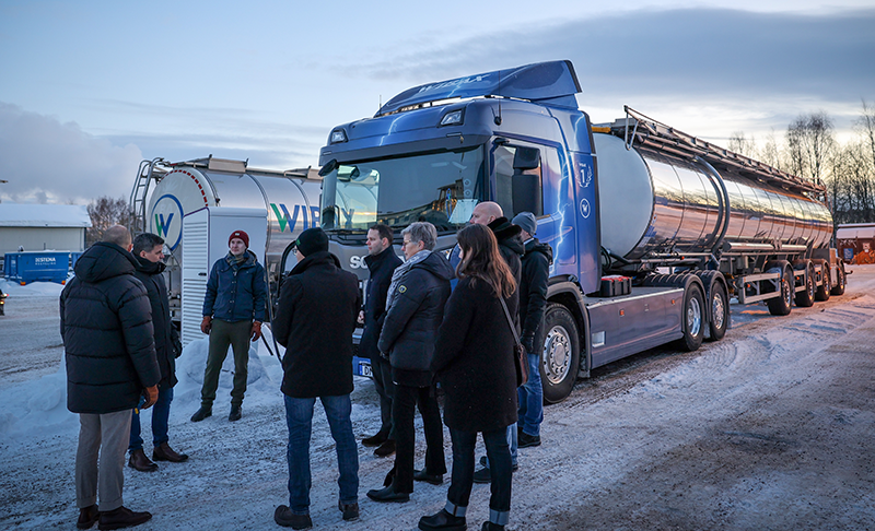 People gathered around and watching electric heavy-duty vehicle charging People gathered around and watching electric heavy-duty vehicle charging