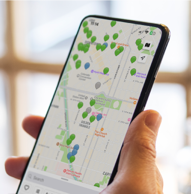 Hand holding a mobile phone with ChargePoint app 