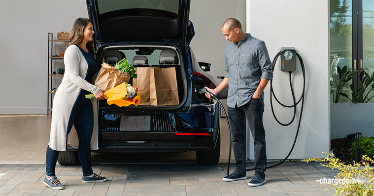 Man charging his car with ChargePoint Home Flex and woman taking out groceries from a car